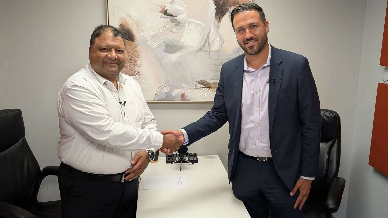 A meaningful handshake between community leaders during a candid conversation highlights partnerships and the collaborative spirit driving positive change for housing and hope across Ontario
